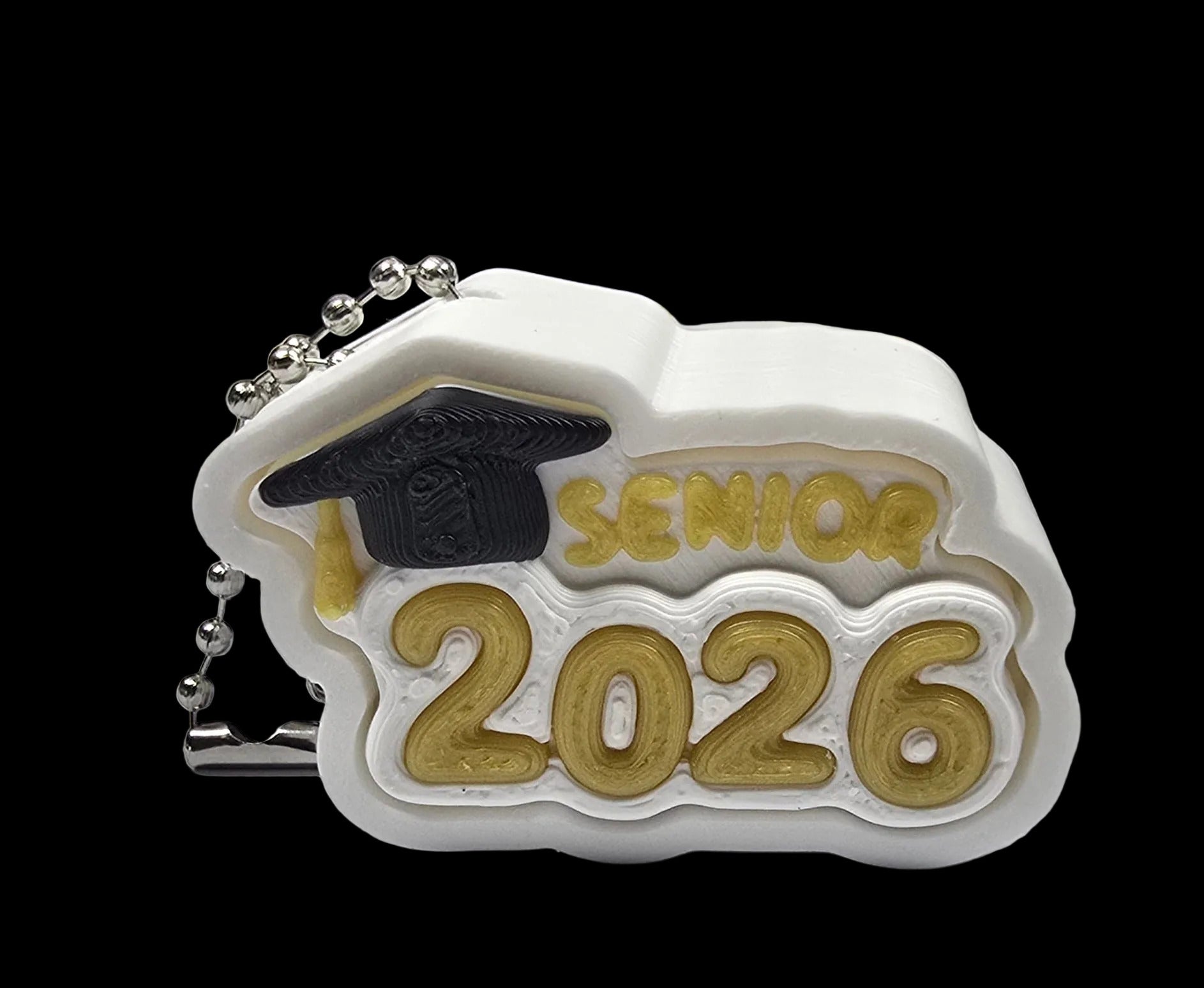 Graduation-themed keychain with 'Senior 2026' text on a white surface.